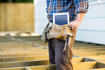 Image showing Construction Worker With Tablet Computer And Hammer In Toolbelt