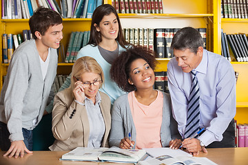 Image showing Teachers Discussing With Students In Library