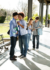 Image showing Woman Showing Mobilephone To Classmate At University Campus