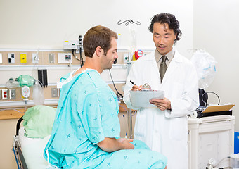 Image showing Doctor Discussing Medical Report With Patient In Hospital