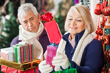 Image showing Woman Buying Presents With Man In Store