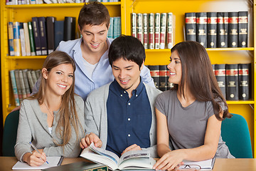 Image showing Woman With Friends Studying In University Library