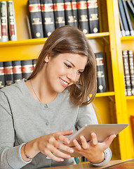 Image showing Woman Using Digital Tablet In College Library