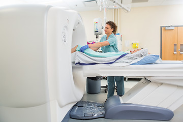 Image showing Nurse Preparing Patient For CT Scan Test