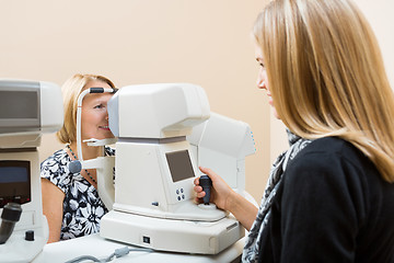 Image showing Optometrist Using Tonometer to Measure Patients Eye Pressure