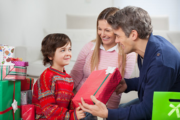 Image showing Father Giving Christmas Gift To Son