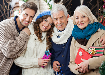 Image showing Happy Loving Family Standing In Christmas Store