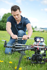 Image showing Engineer Fixing Propeller Of UAV Drone