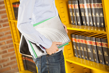 Image showing Student Holding Books In College Library