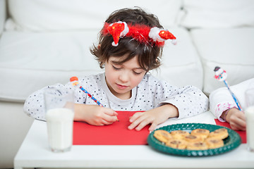 Image showing Boy Writing Letter To Santa Claus