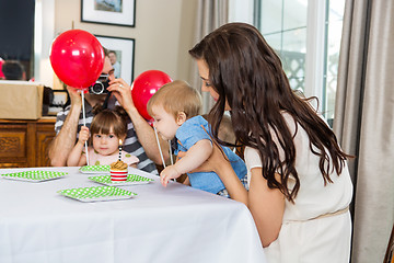 Image showing Family Celebrating Son's Birthday At Home