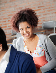 Image showing Female Student Sitting With Classmate In Classroom