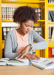 Image showing Student Studying At Table In University Library