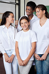 Image showing Girl Standing With Teacher And Classmates In Lab