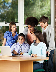 Image showing Professor With Laptop Explaining Students In Classroom