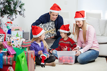 Image showing Family With Christmas Gifts And Decorations