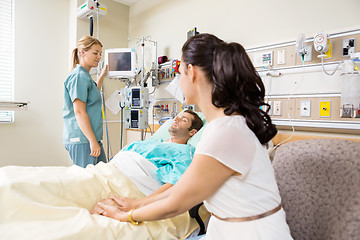 Image showing Woman Holding Patient's Hand In Hospital