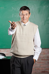 Image showing Confident Professor Gesturing In Classroom