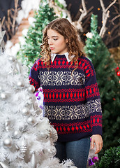 Image showing Woman Buying Decorated Christmas Tree