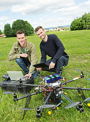 Image showing Technicians With Laptop And Digital Tablet By UAV