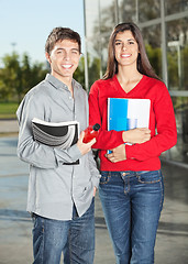 Image showing Students Holding Books While Standing In College