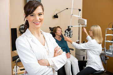 Image showing Eye Specialist With Colleague Examining Patient