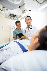 Image showing Medical Team Looking At Patient On Xray Table