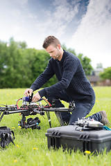 Image showing Young Engineer Assembling UAV