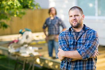 Image showing Confident Manual Worker With Hands Folded At Construction Site