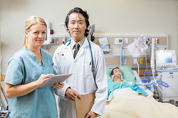 Image showing Nurse And Doctor With Patient Resting In Hospital