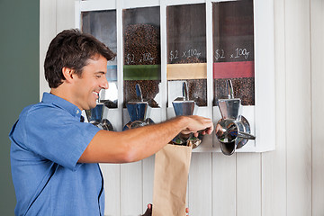 Image showing Man Buying Coffee From Vending Machine In Supermarket