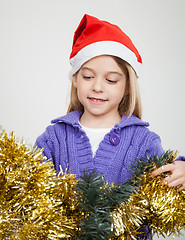 Image showing Girl Looking At Tinsels During Christmas