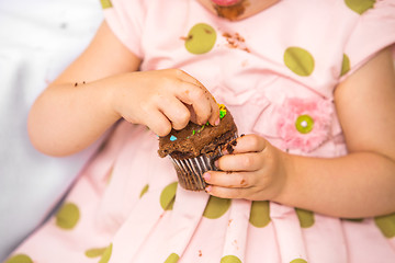 Image showing Birthday Girl Eating Cupcake