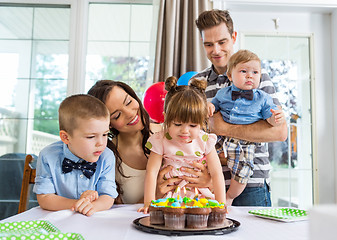 Image showing Family Celebrating Girl's Birthday