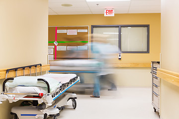 Image showing Nurses With Stretcher Walking In Hospital Corridor