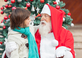 Image showing Boy And Santa Claus Looking At Each Other