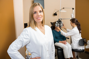 Image showing Eye Doctor With Colleague Examining Patient