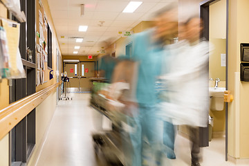 Image showing Doctor And Nurse Pulling Stretcher In Hospital