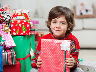 Image showing Cute Boy With Holding Christmas Present