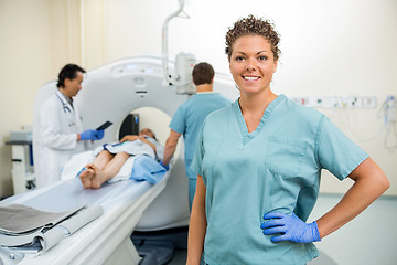 Image showing Nurse With Colleague And Doctor Preparing Patient For CT Scan