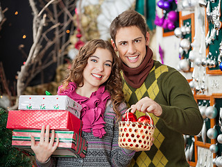 Image showing Couple Shopping Presents In Christmas Store