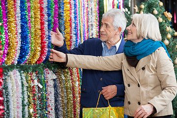 Image showing Couple Shopping For Tinsels At Store