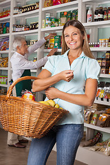 Image showing Happy Woman Holding Shopping Basket