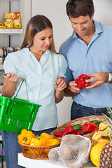 Image showing Couple Buying Vegetables In Grocery Store