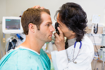 Image showing Doctor With Ophthalmoscope Examining Patient's Eye