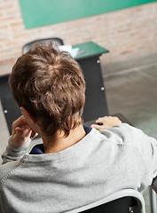 Image showing Male Student Sitting In Classroom