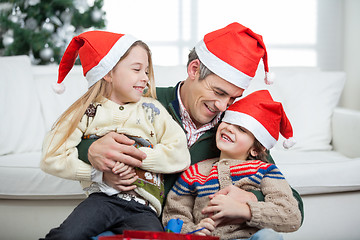 Image showing Loving Father With Arms Around Children