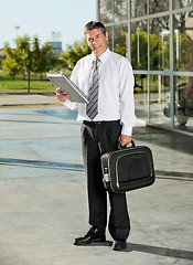 Image showing College Professor With Books And Bag At Campus