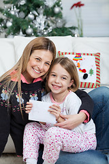 Image showing Happy Mother And Daughter With Letter