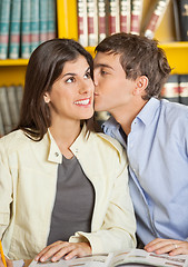 Image showing Man Kissing Girlfriend In College Library